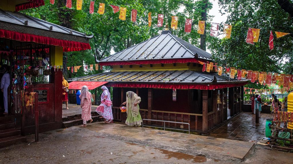 Exterior view of Budha Subba Temple surrounded by trees in Dharan
