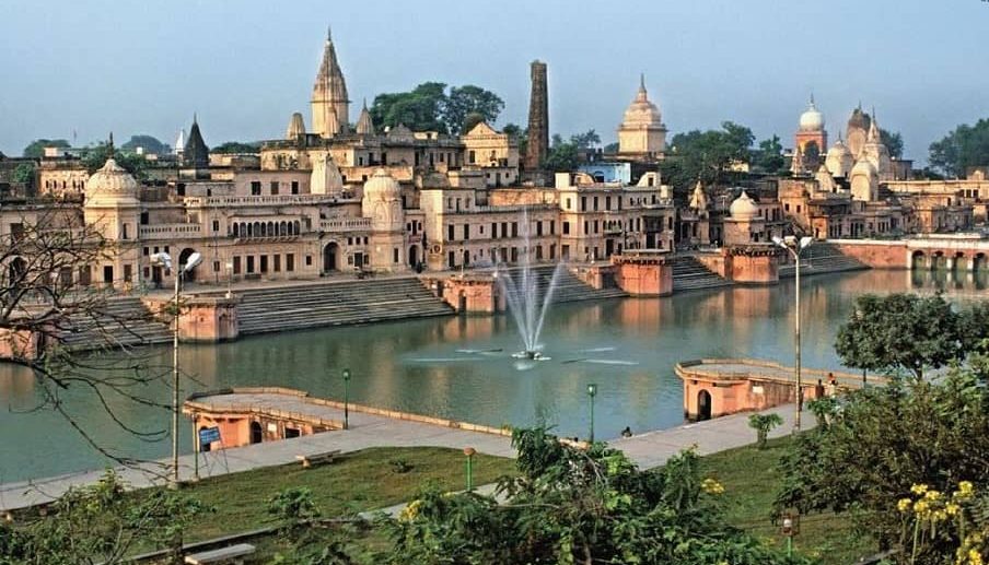 Peaceful view of a ghat along the Saryu River in Ayodhya with temple structures and sacred ambiance