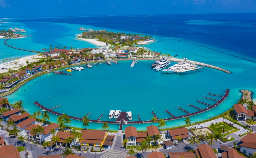 Aerial view of SAii Lagoon Maldives showing turquoise waters, overwater villas, and white sandy beaches