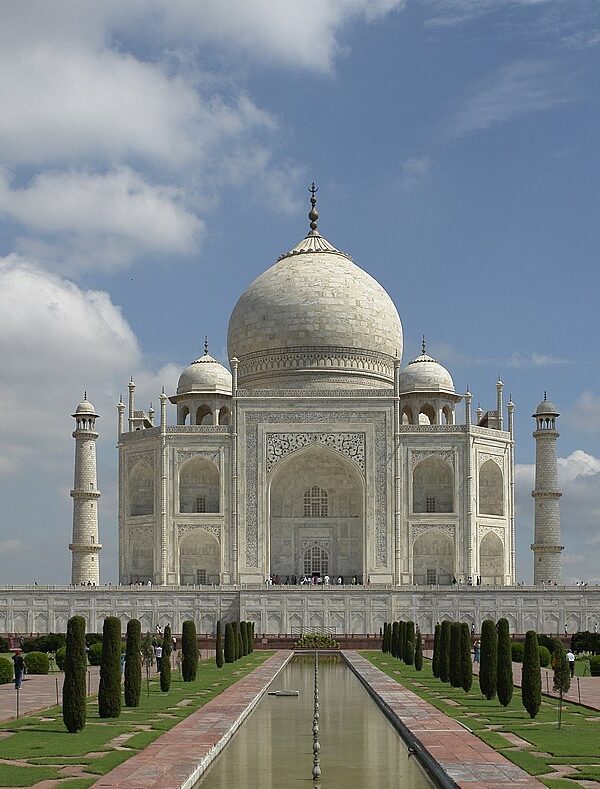 Front view of the Taj Mahal mausoleum with its white marble domes and reflecting pool, Agra, India