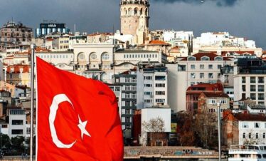Panoramic view of Istanbul city with the Turkish flag waving