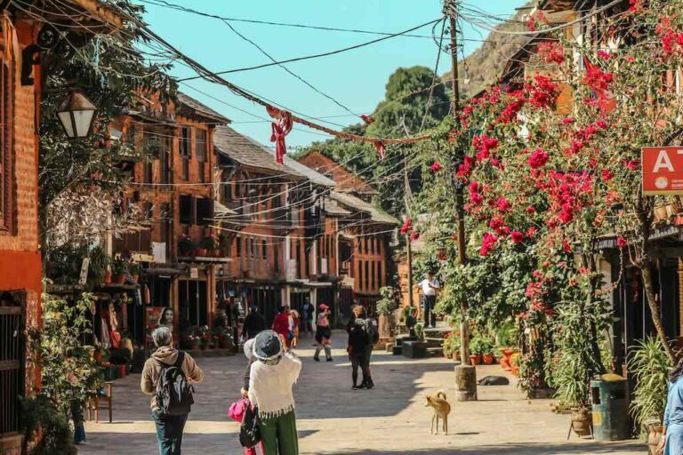 Busy market stalls and locals shopping at Bandipur Bazar