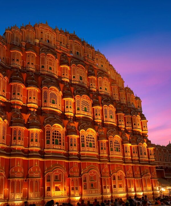 Evening view of Hawa Mahal illuminated by warm lights in Jaipur, Rajasthan, India