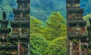 The iconic Handara Gate framed by vibrant greenery and tropical plants in Bali