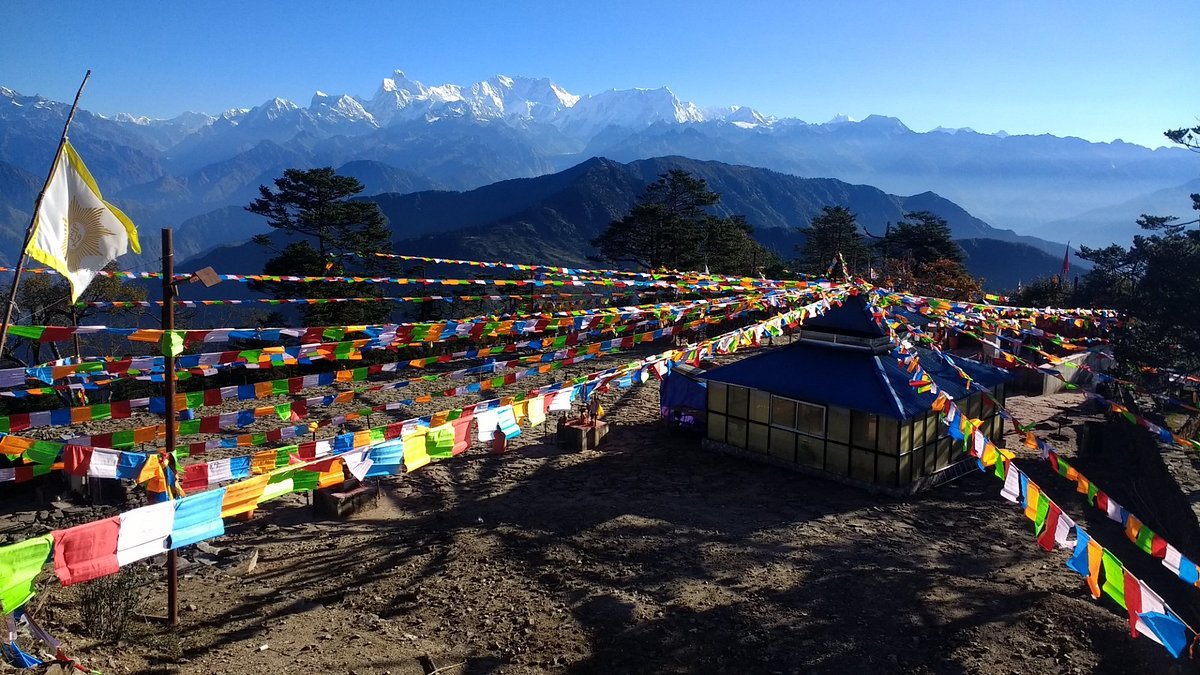 Aerial view of Pathibhara Temple situated atop a hill with Himalayan mountains in the background
