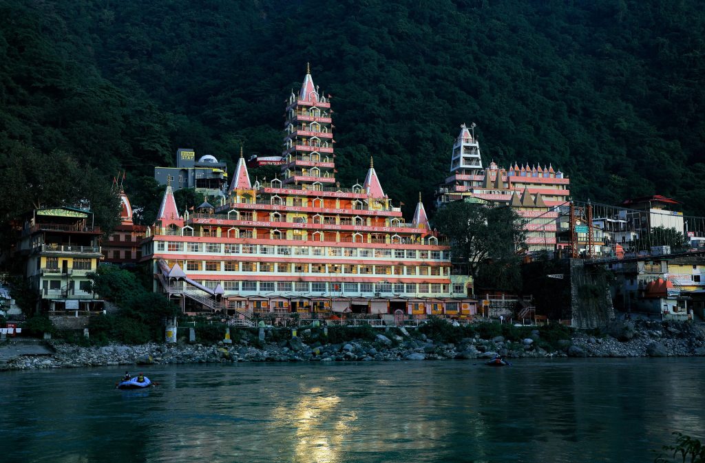 Rishikesh town with Ganga River and temples along the riverbank