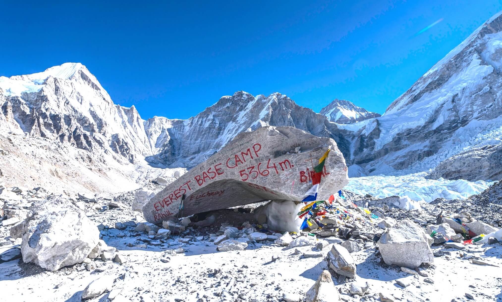 Everest Base Camp trek with panoramic Himalayan mountain views and trekkers walking toward Mount Everest