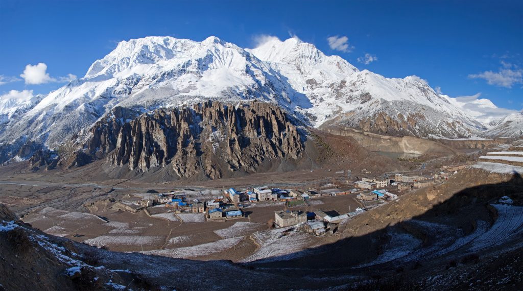 Manang village with Annapurna III and Gangapurna peaks in the Himalayan range, Nepal.