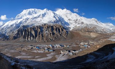 Manang village with Annapurna III and Gangapurna peaks in the Himalayan range, Nepal.